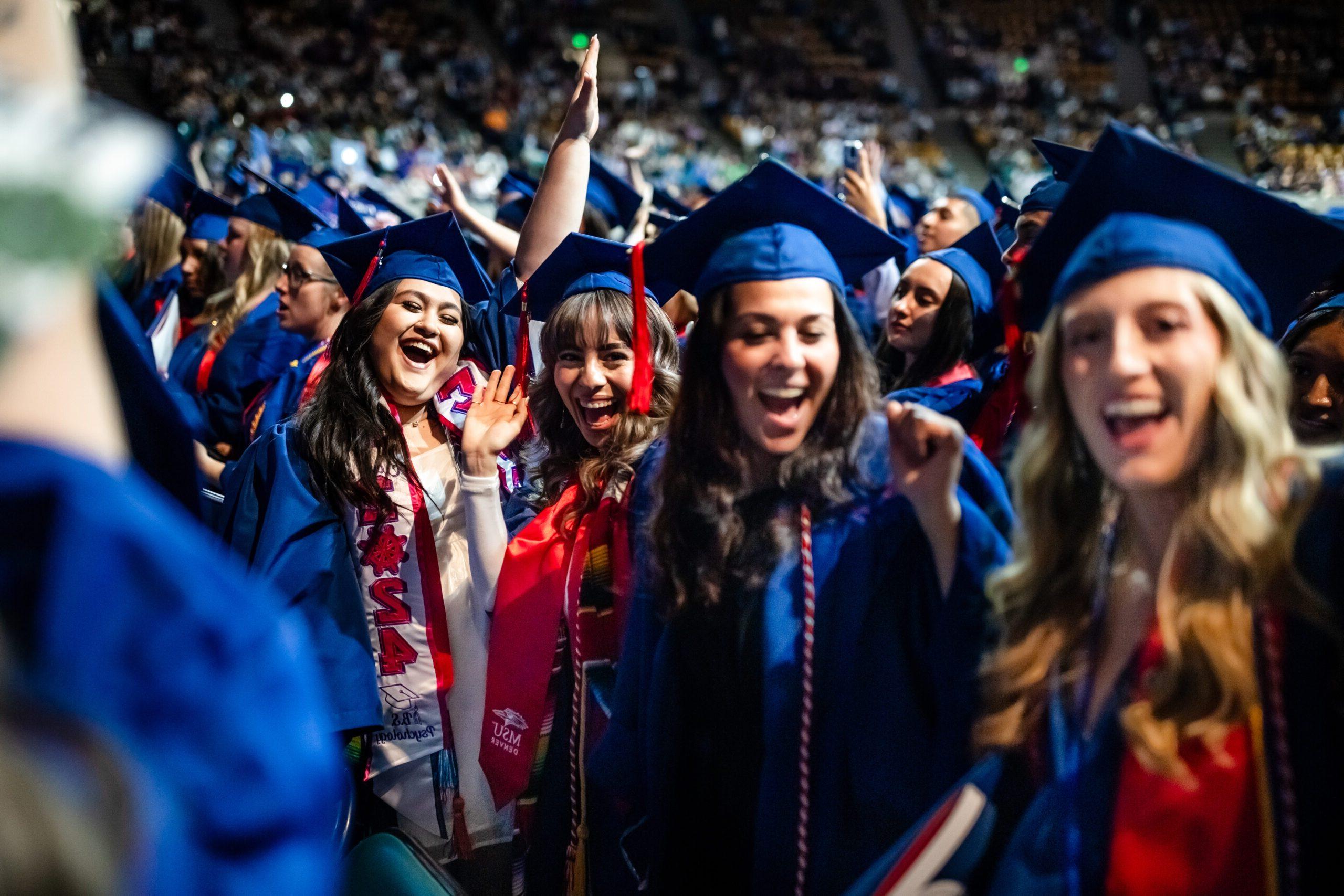 A group celebrate at the Commencement ceremony.